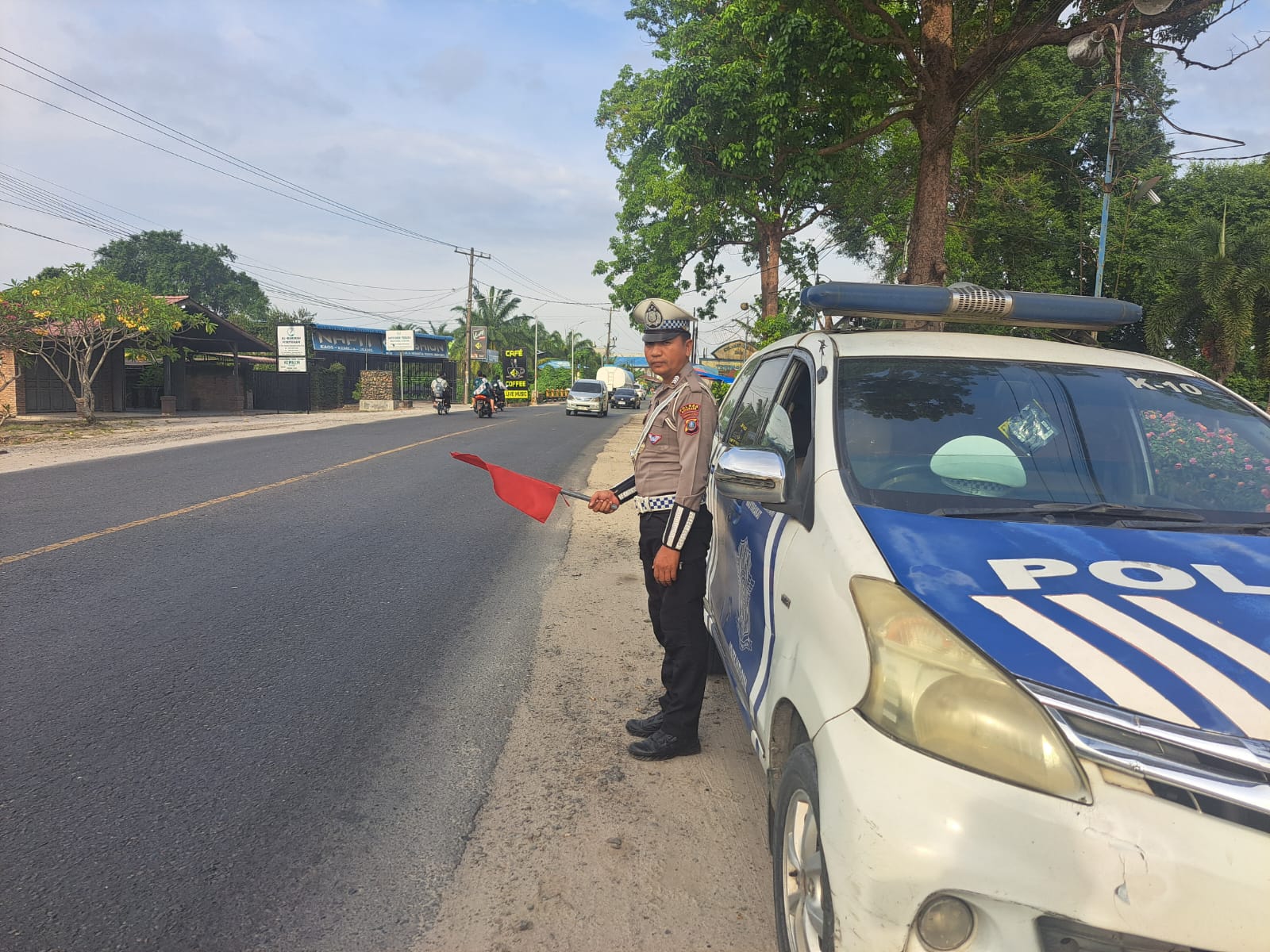 Satlantas Polres Batu Bara Sukseskan Live Report Pengaturan Lalu Lintas dan Patroli Kibas Bendera
